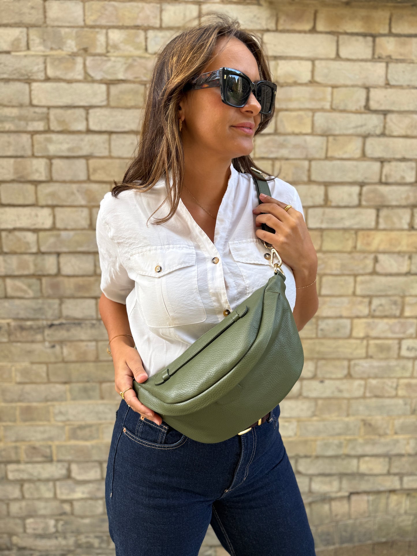 Girl wearing khaki leather bumbag