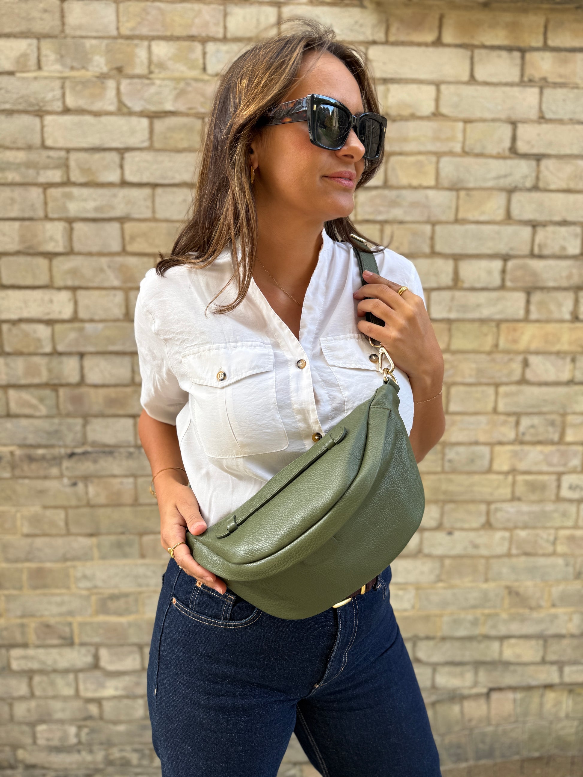 Girl wearing khaki leather bumbag