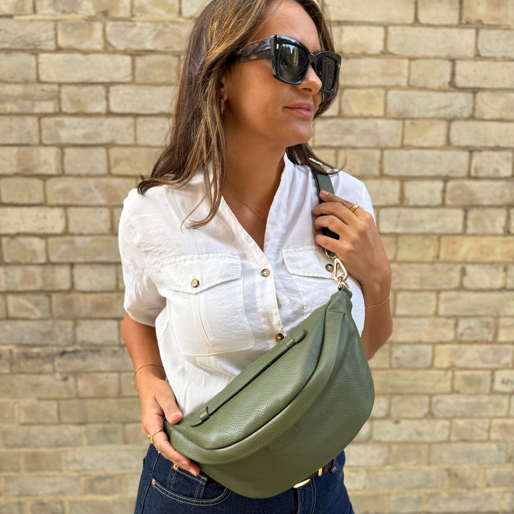 Girl wearing khaki leather bumbag