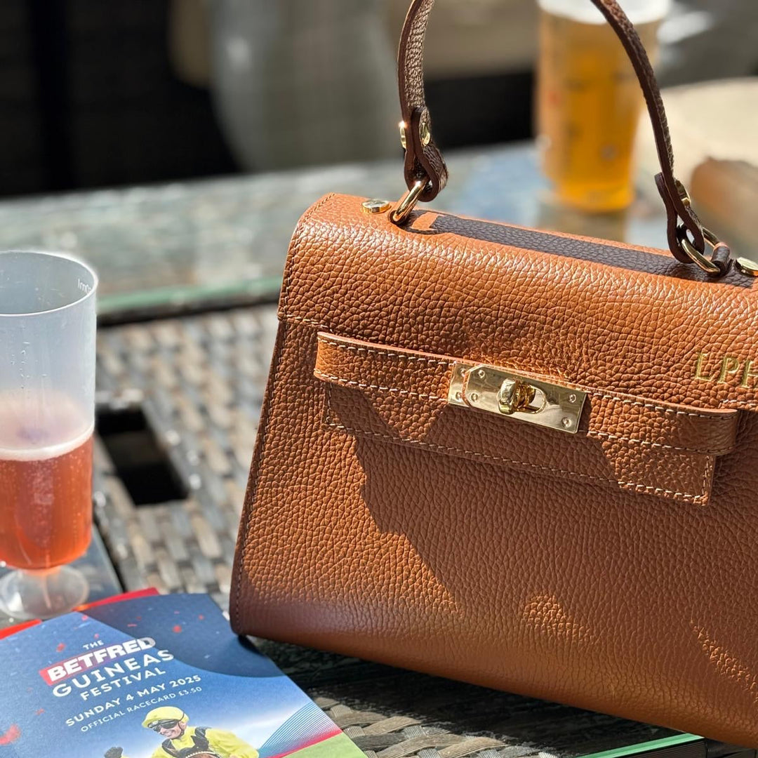 Close-up of Grace [colour] leather bag showing gold initials personalised 