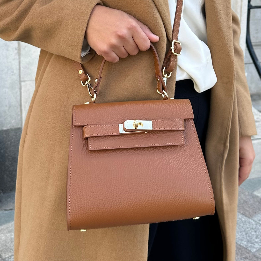 close up of grace tan top handle crossbody bag 