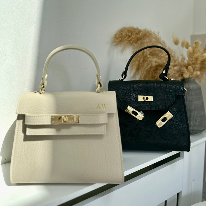 close of complimentary personalisation on grace leather handbag cream