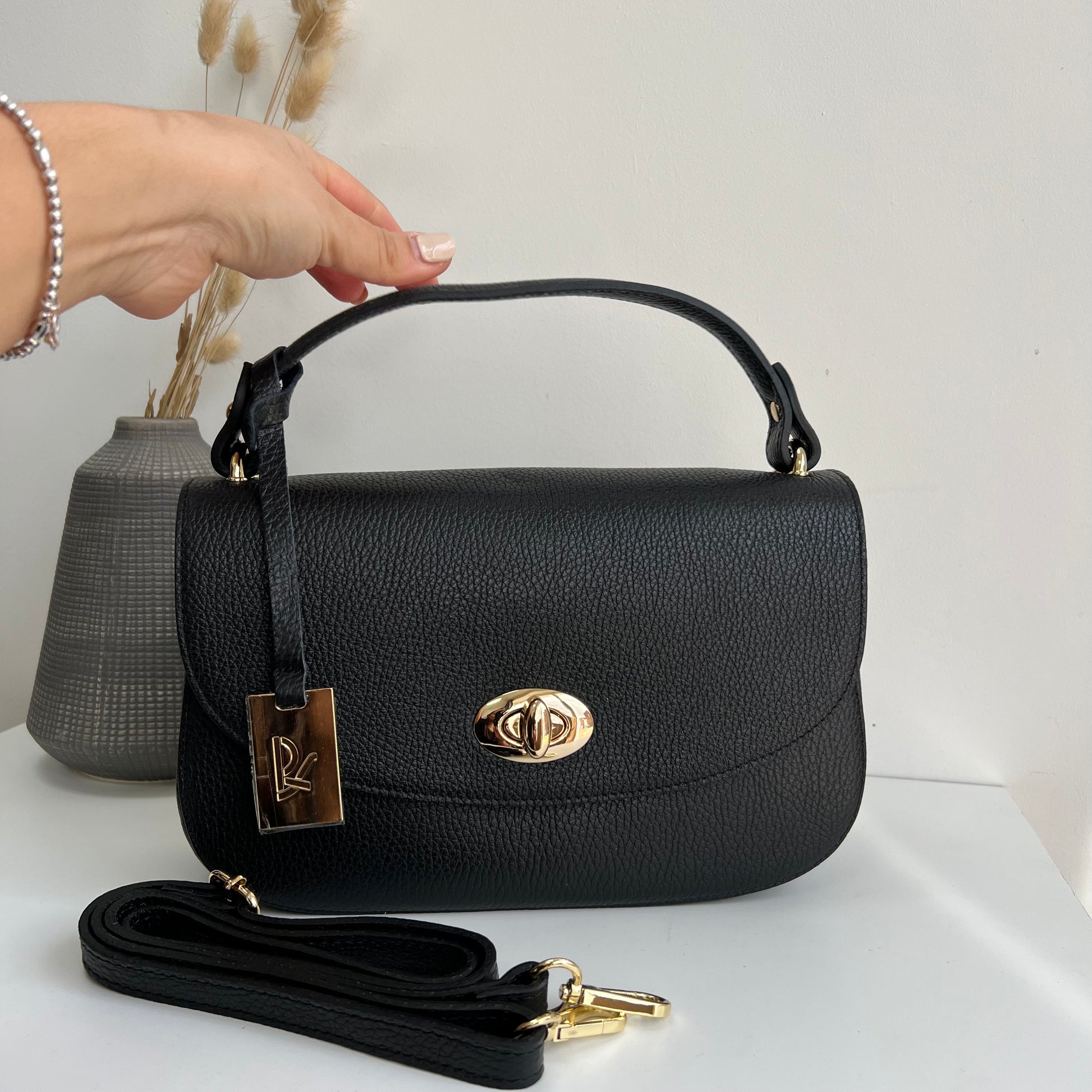 SAMPLE Black Clasp top handle Leather Crossbody Bag